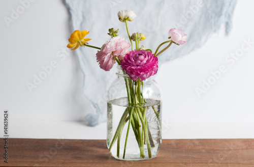 Wallpaper Mural Light and airy colorful spring ranunculus flowers in a jar Torontodigital.ca