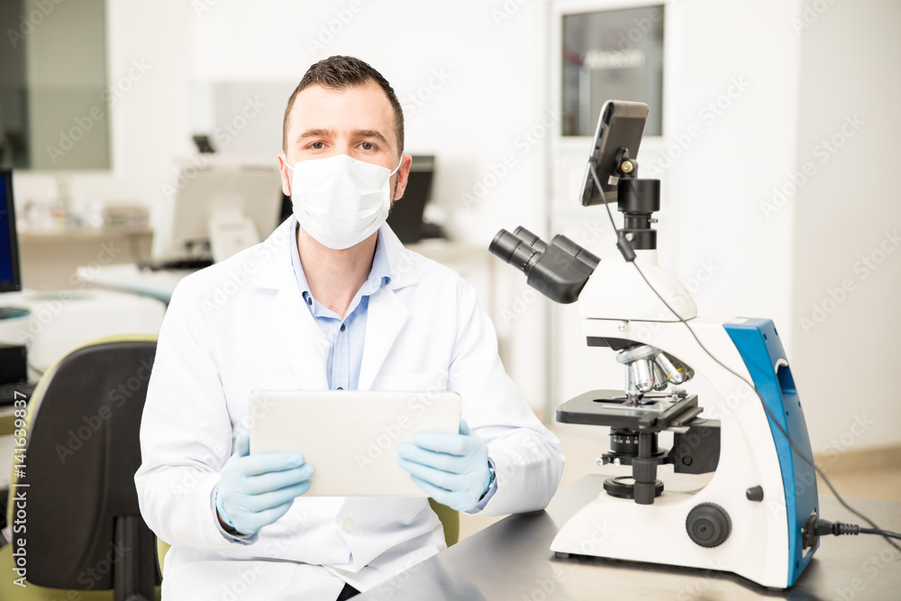 Scientist using technology at a laboratory Scientist using technology at a laboratory