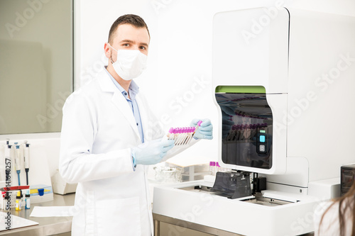 Hispanic male chemist working in a lab