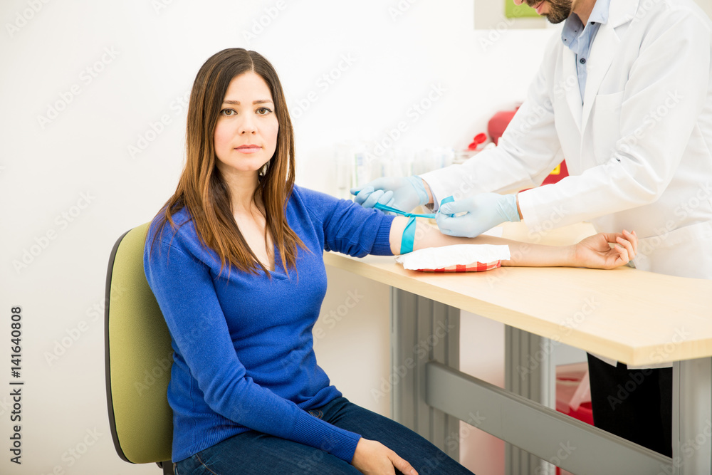 Fototapeta premium Nervous patient getting a blood test