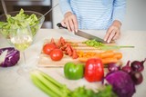 Senior woman cutting vegetable 