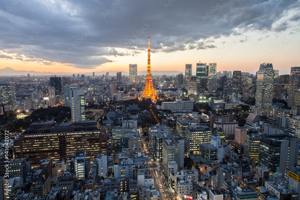 the red tokyo tower in sunset 
