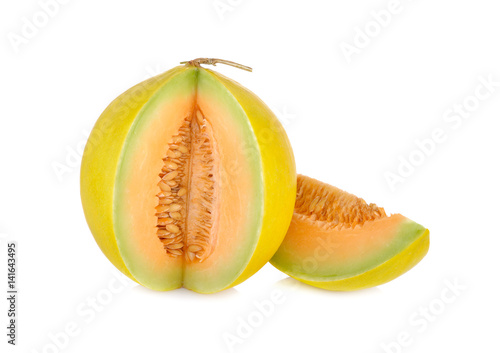 portion cut fresh yellow melon with stem on white background