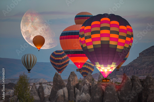 Fotografie Hot air balloon flying over spectacular Cappadocia Elements of this image furni