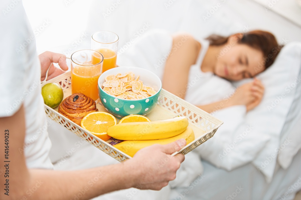 Relaxed Couple in Bed in bedroom at home Relaxed Couple in Bed in bedroom at home