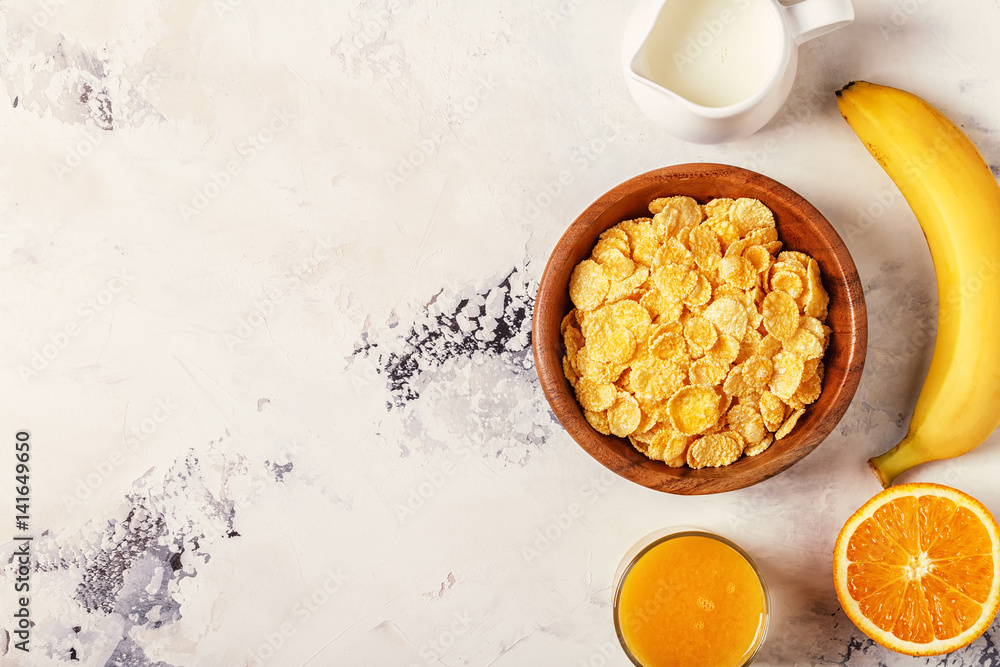 Healthy breakfast - bowl of corn flakes, nuts and fruit Healthy breakfast - bowl of corn flakes, nuts and fruit