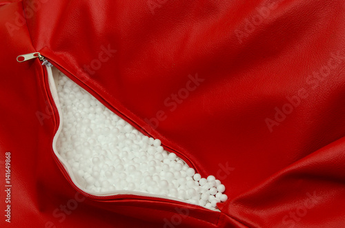 Foam balls in red leather furniture