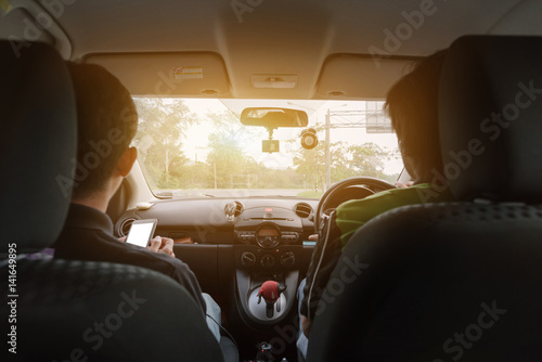 Hands of Asian man on steering wheel, A car have camera gps and telephone holder in selective focus, in concept Safe Drive © ichz