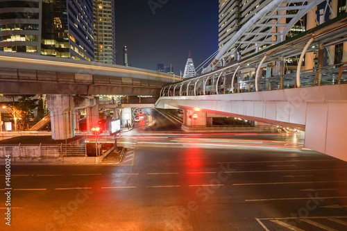 Light stream of traffic on Central Bangkok at night.