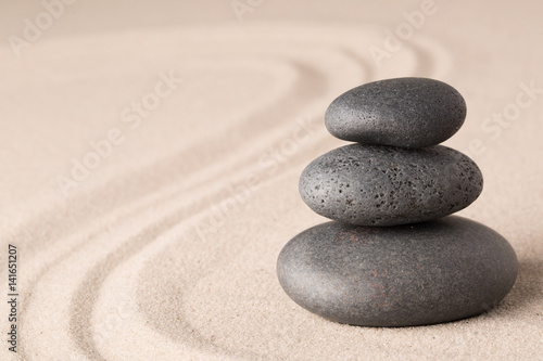 spa wellness hot stone therapy or zen meditation stones and sand for relaxation and concentration.