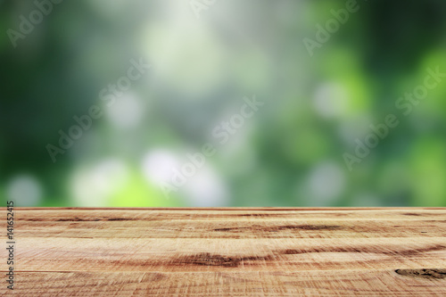 Empty wooden and blur bokeh background.