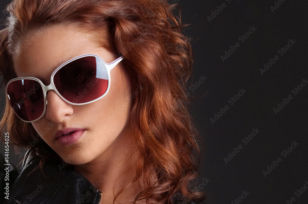 Fashionable girl with curly red hair in lingerie, leather jacket Fashionable girl with curly red hair in lingerie, leather jacket