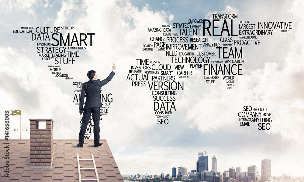 Businessman on brick roof draw world map as concept of globaliza Businessman on brick roof draw world map as concept of globaliza