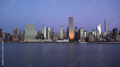 Golden sunset Manhattan Downtown panorama skyscrapers, New York City NYC Skyline. Apartments Buildings. The skyline of New York City at Sunset filmed from the the New Jersey.