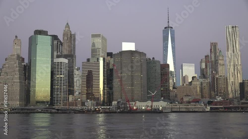 Golden sunset Manhattan Downtown panorama skyscrapers, New York City NYC Skyline. Apartments Buildings. The skyline of New York City at Sunset filmed from the the New Jersey.