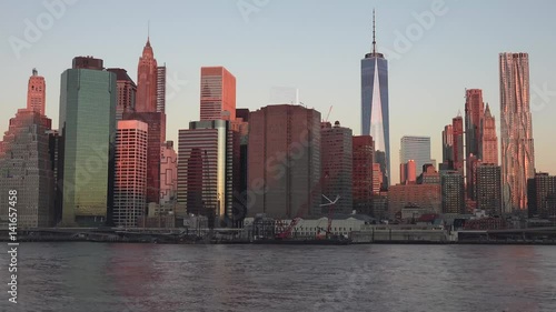 Golden sunset Manhattan Downtown panorama skyscrapers, New York City NYC Skyline. Apartments Buildings. The skyline of New York City at Sunset filmed from the the New Jersey.