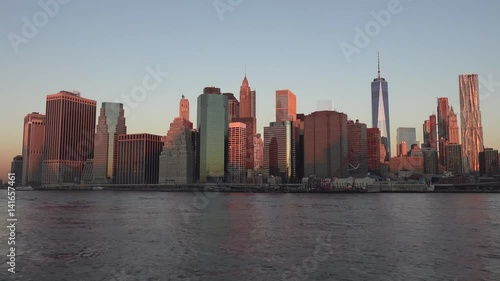 Golden sunset Manhattan Downtown panorama skyscrapers, New York City NYC Skyline. Apartments Buildings. The skyline of New York City at Sunset filmed from the the New Jersey.