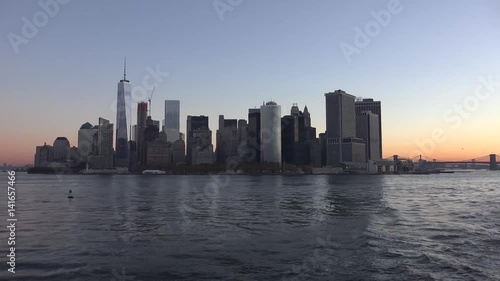 Golden sunset Manhattan Downtown panorama skyscrapers, New York City NYC Skyline. Apartments Buildings. The skyline of New York City at Sunset filmed from the the New Jersey.