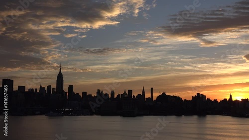 Golden sunset Manhattan Downtown panorama skyscrapers, New York City NYC Skyline. Apartments Buildings. The skyline of New York City at Sunset filmed from the the New Jersey.