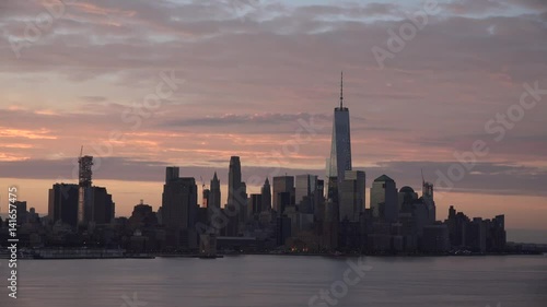 Golden sunset Manhattan Downtown panorama skyscrapers, New York City NYC Skyline. Apartments Buildings. The skyline of New York City at Sunset filmed from the the New Jersey.