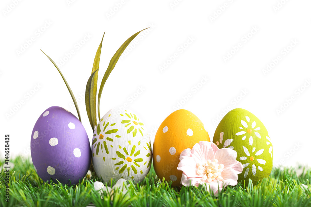 Row of Easter eggs on grass Row of Easter eggs on grass