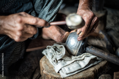 At silversmith's workshop with traditional tools