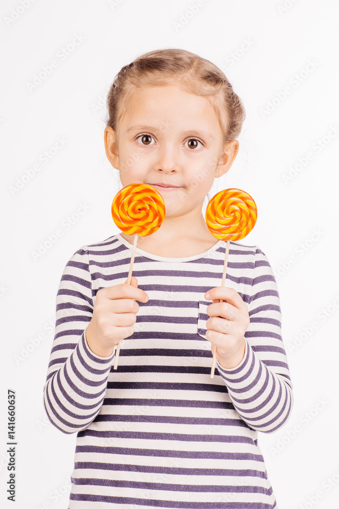 Happy girl with lollipop.