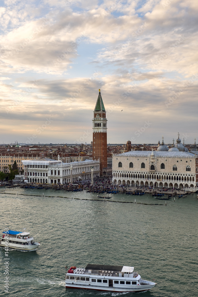 Venetian aerial view from the cruise ship which leaves the port of Venice (Venezia Terminal Passegeri Porto) with St Mark's Campanile bell tower of St Mark's Basilica. Italy.