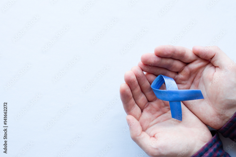 man holding a symbol of the blue ribbon man holding a symbol of the blue ribbon