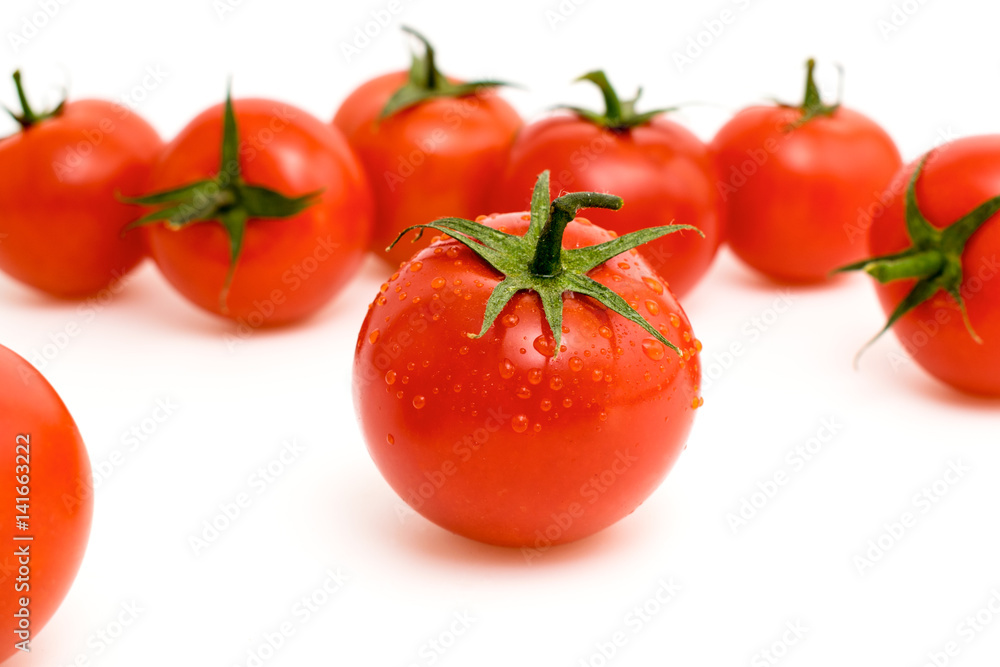Ripe red tomatoes on a white