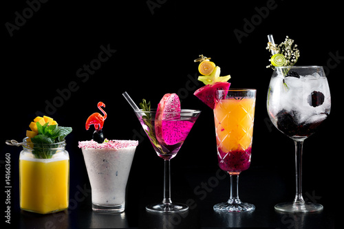 Obraz na płótnie modern rustic selection of cocktails drinks alcohol at bar counter with defocused background various colours glass w salonie