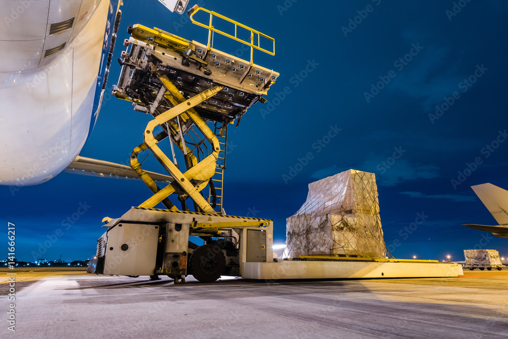 Loading cargo on the plane at airport, twilight time - obrazy, fototapety, plakaty 