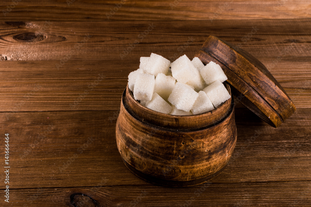 Diabetes. A lot of sugar cubes in jar Diabetes. A lot of sugar cubes in jar