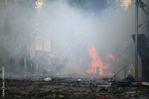 Bild auf Leinwand Car overturned and burned
Street damage caused during a student strike in Santiago's Downtown, Chile