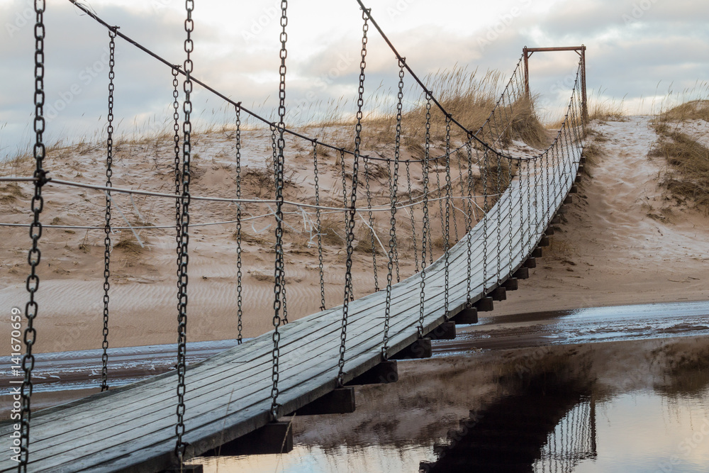 Fototapeta premium Suspension bridge over the river