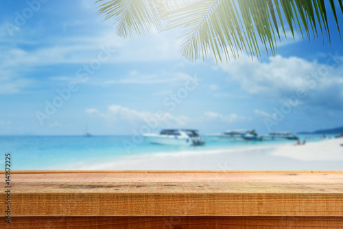 Beach background and wooden table.