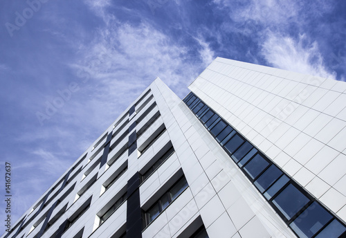 Corner office building view from below against sky