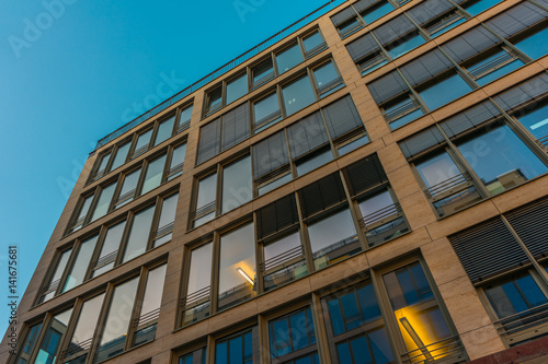 Low angle view on apartment with window guards