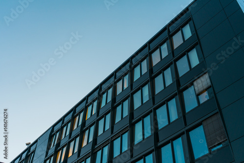 Apartment building with dark metal exterior