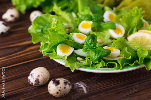Letucce, cucumber, spinach, basil and quail eggs salad