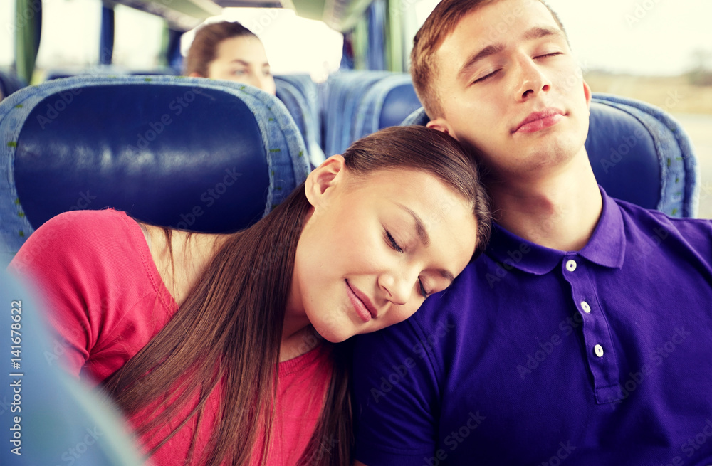 happy couple or passengers sleeping in travel bus happy couple or passengers sleeping in travel bus