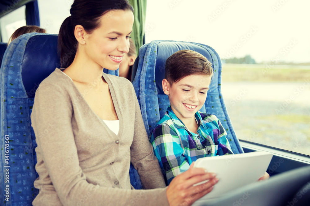 happy family with tablet pc sitting in travel bus happy family with tablet pc sitting in travel bus