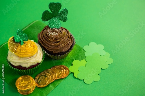 St Patrick's Day shamrock on the cupcake with gold coins