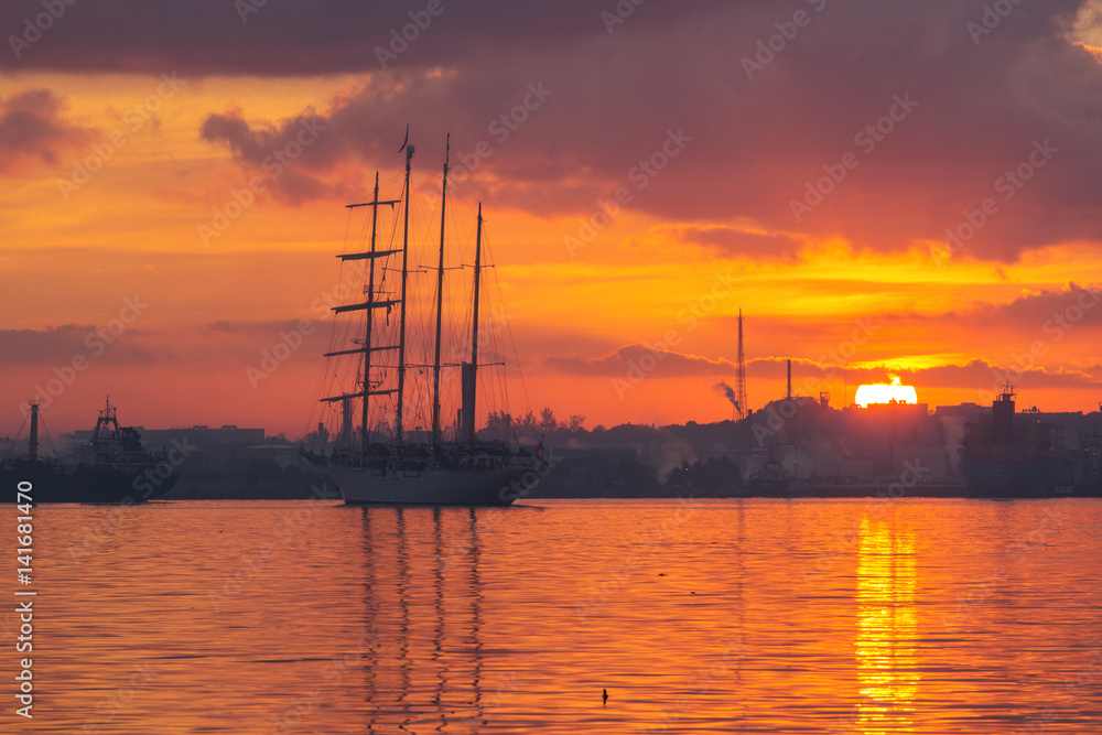 Sail boat at sunrise in Havana port, Cuba