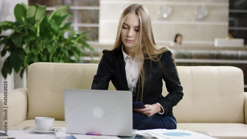 businesswoman working with laptop and documents