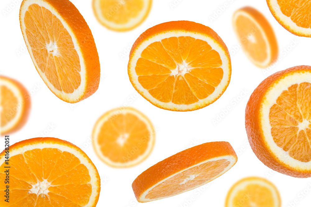 Close-up falling pieces of orange, isolated on white Close-up falling pieces of orange, isolated on white