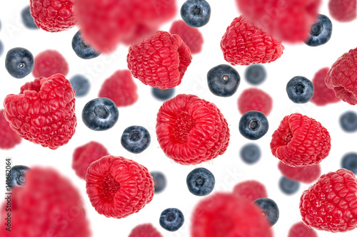 Wallpaper Mural Flying blueberries and raspberries, isolated on white Torontodigital.ca