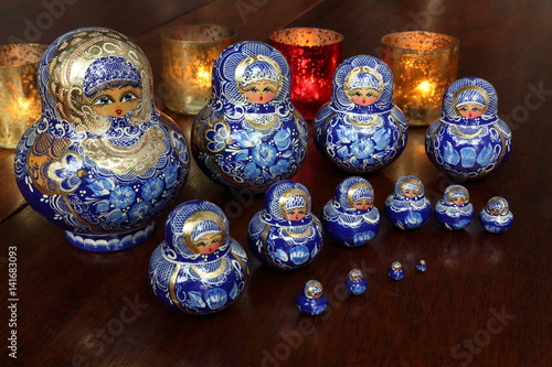 Traditional Russian dolls on wooden table