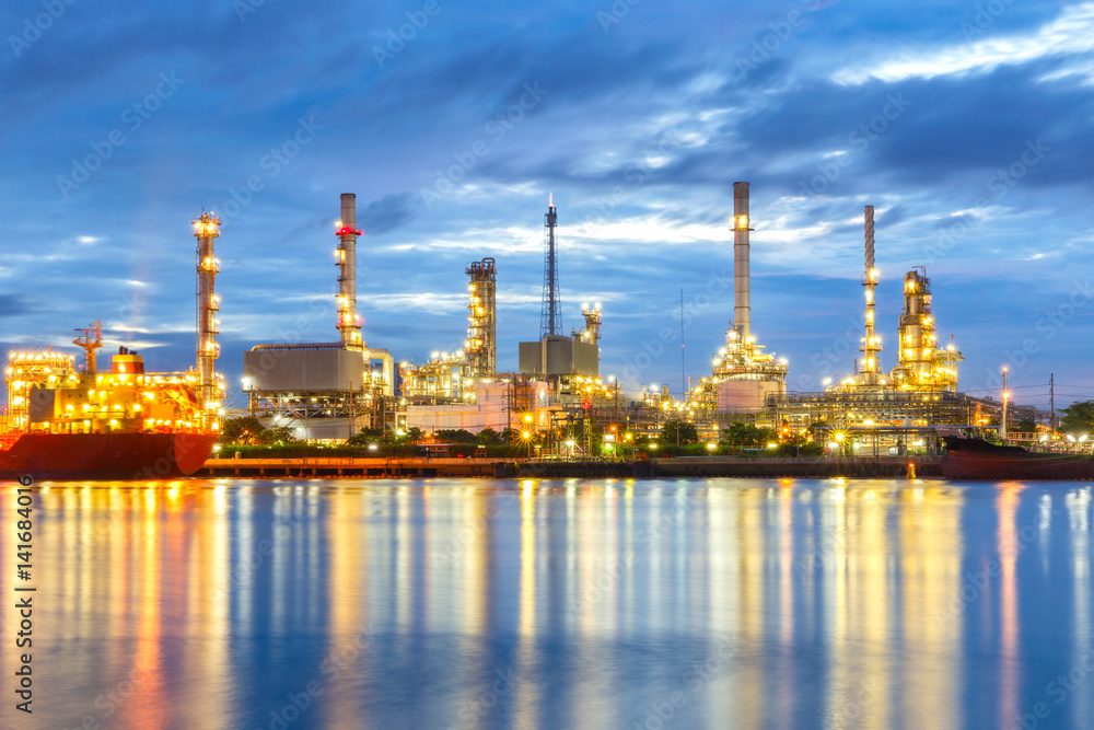 Oil refinery at twilight with dark sky background. Oil refinery at twilight with dark sky background.