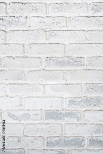 Abstract vertical white background of a brick wall.